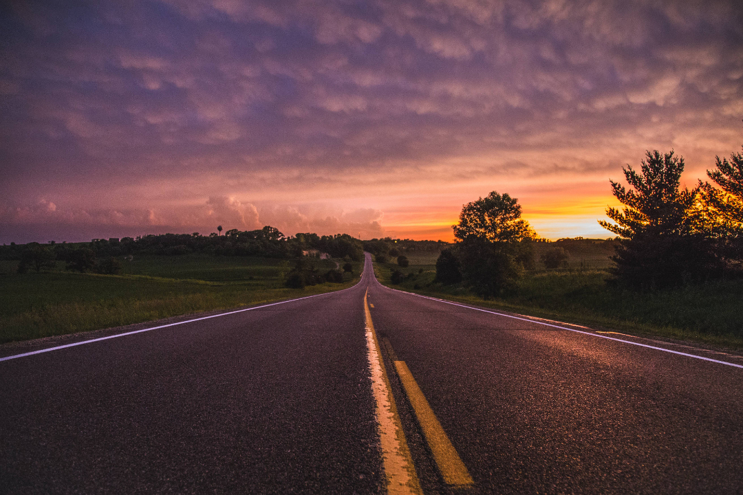 inspiring road leading to the future in front of a sunrise