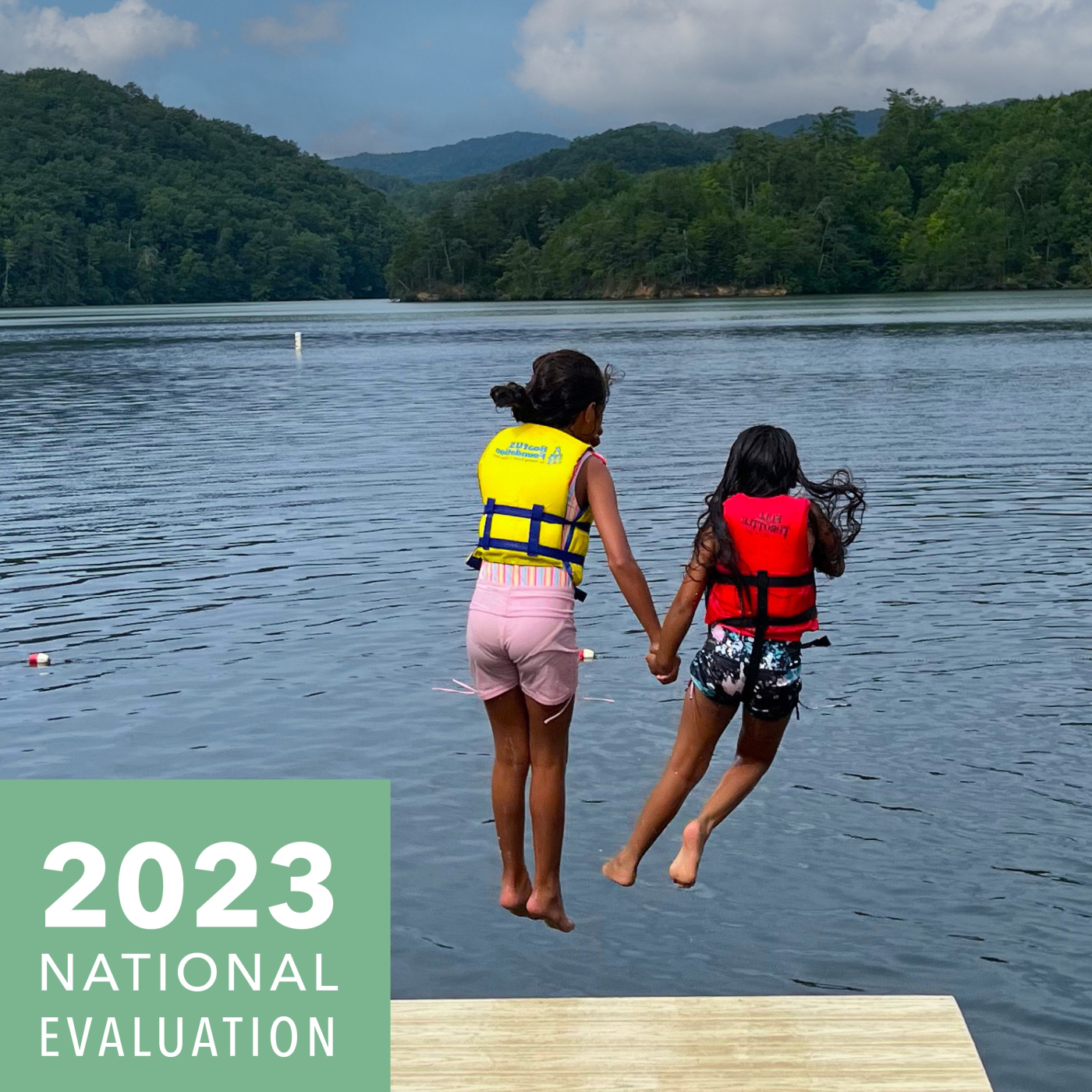 Impact Report Cover with two girls jumping into a lake
