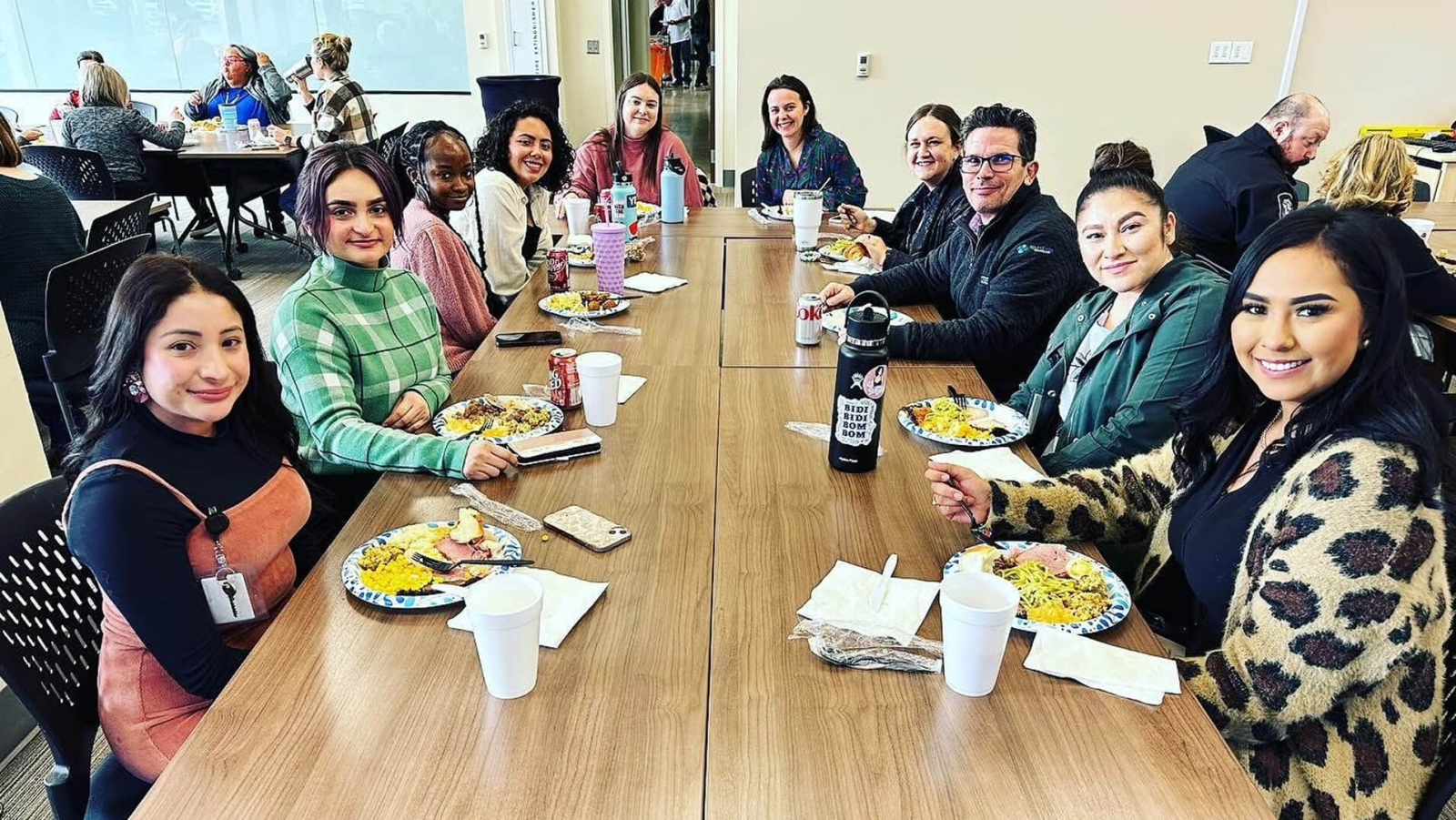 A group of volunteers gathered around a table